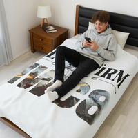 Teen boy with fluffy hair on bed with Stand Firm NWC8 blanket using phone